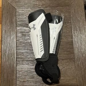 New never worn Under Armour  both Left and Right shin guards